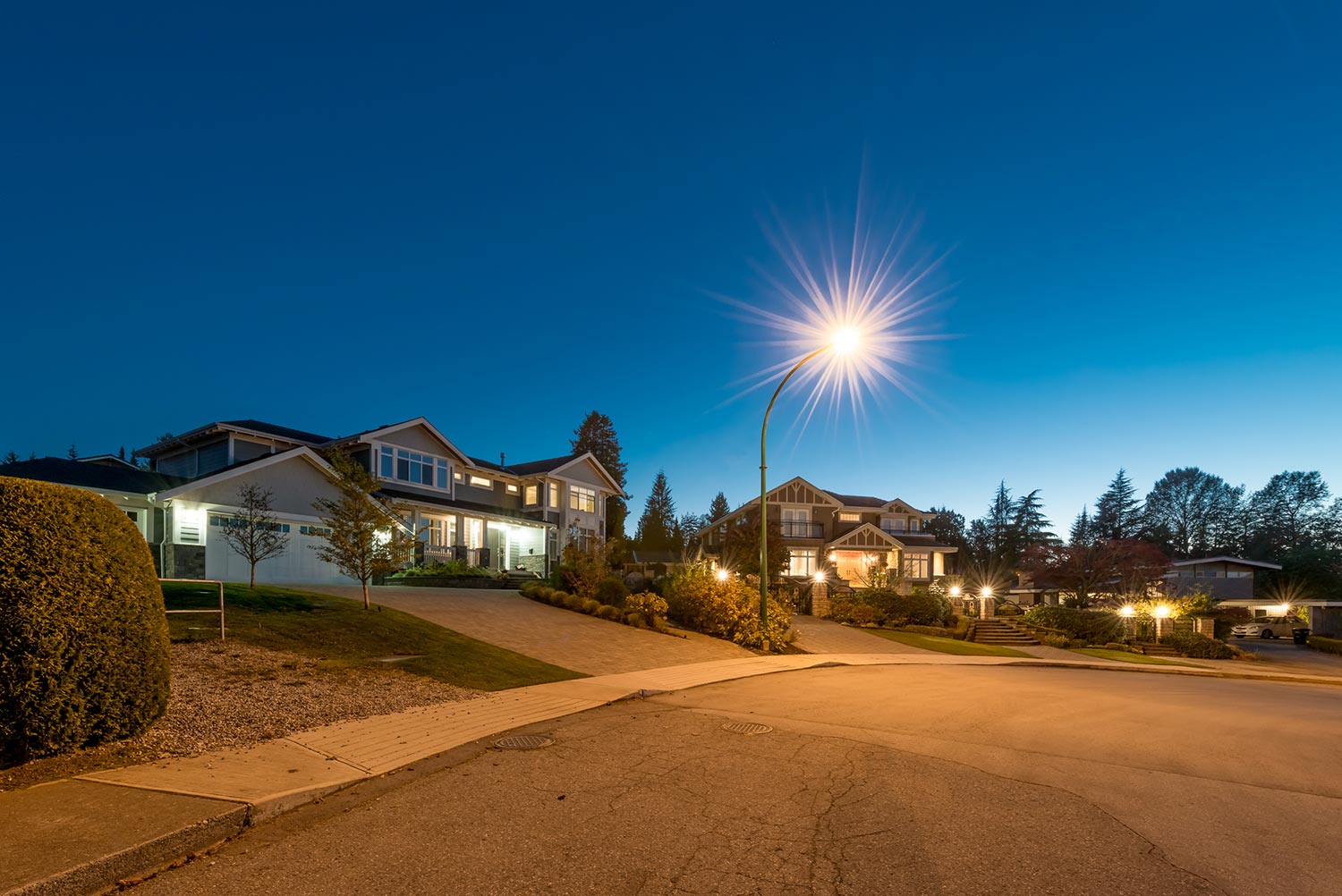 Luxury houses with nicely paved doorway at dusk