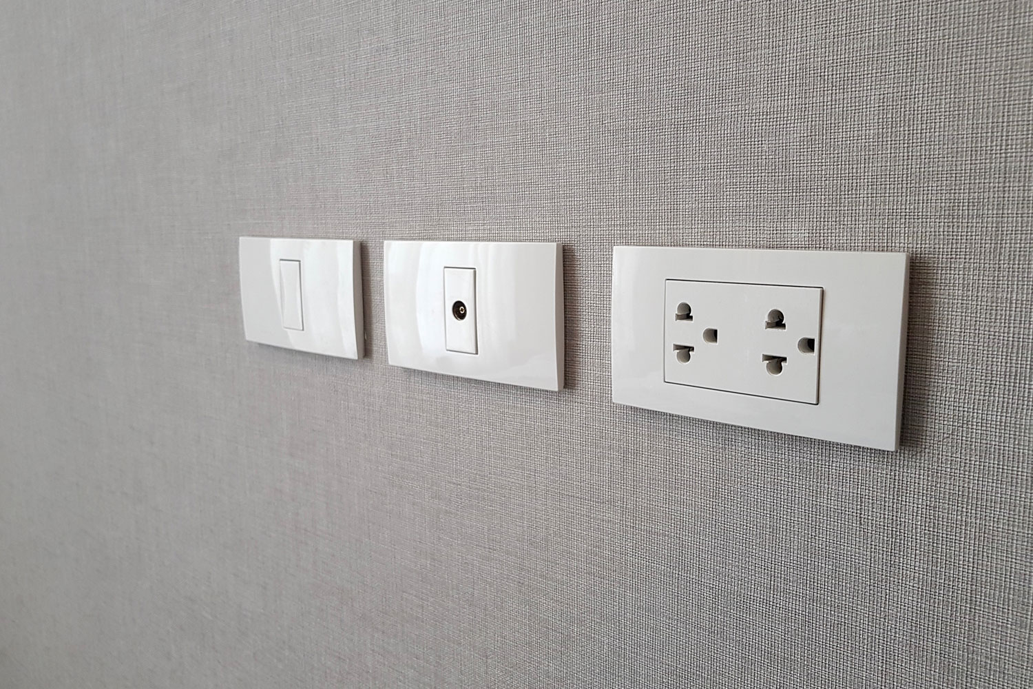 Plugs and switches mounted on the wall