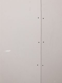 Unplastered drywall background with drywall screws - Drywall Screws Showing Through Paint - What To Do