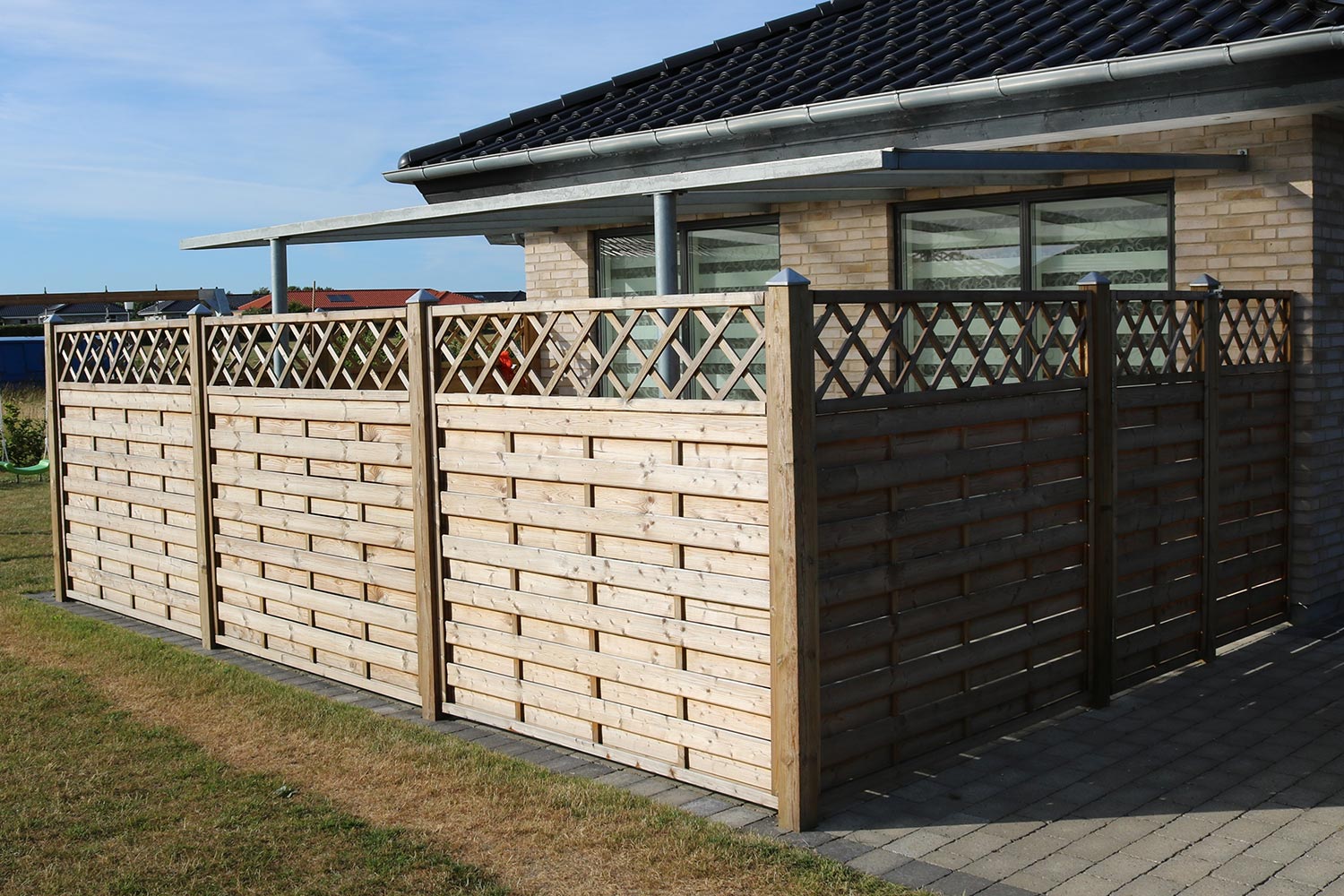 Wooden fence with privacy lattice screen