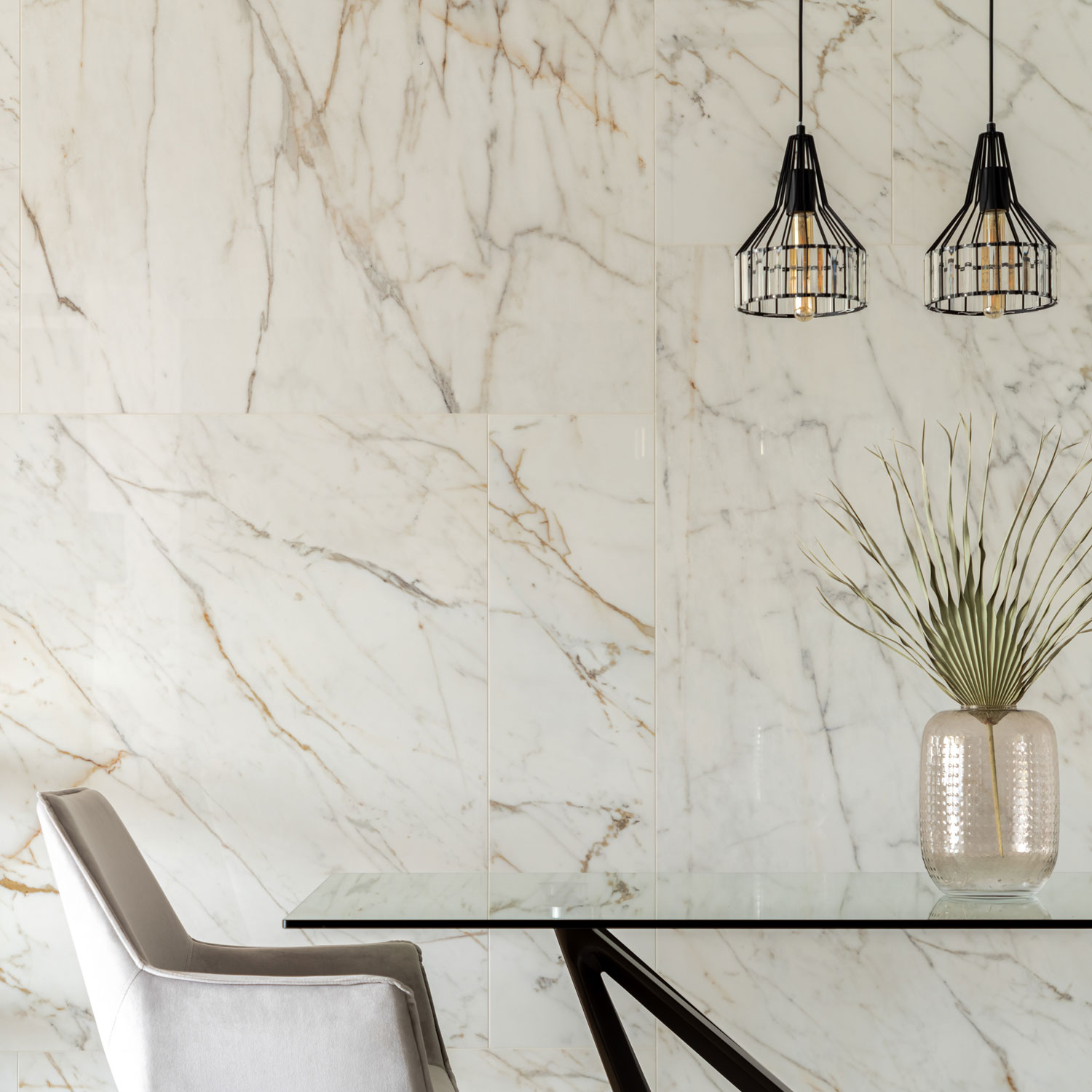A marble wall inside an ultra luxurious kitchen with minimalist kitchen tables and dining table