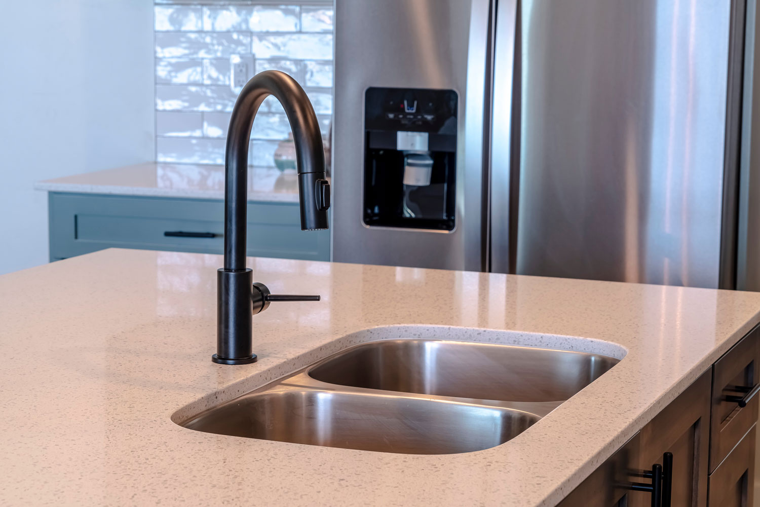 A powder coat black faucet matched with stainless steel sink