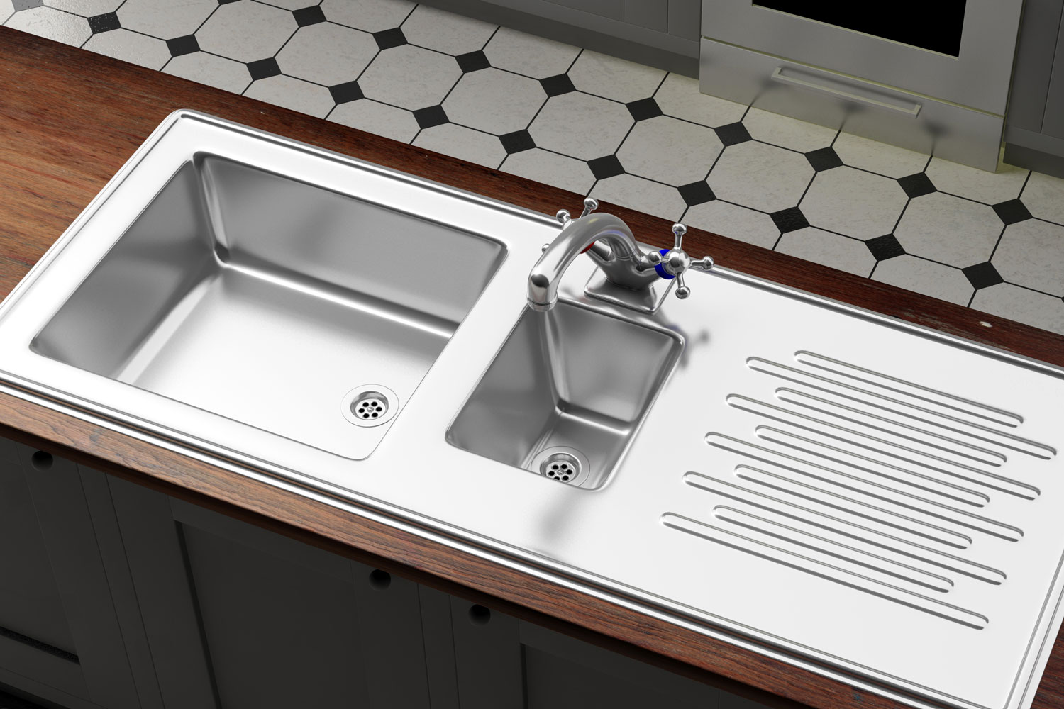 A stainless steel sink with wooden countertop inside a modern kitchen