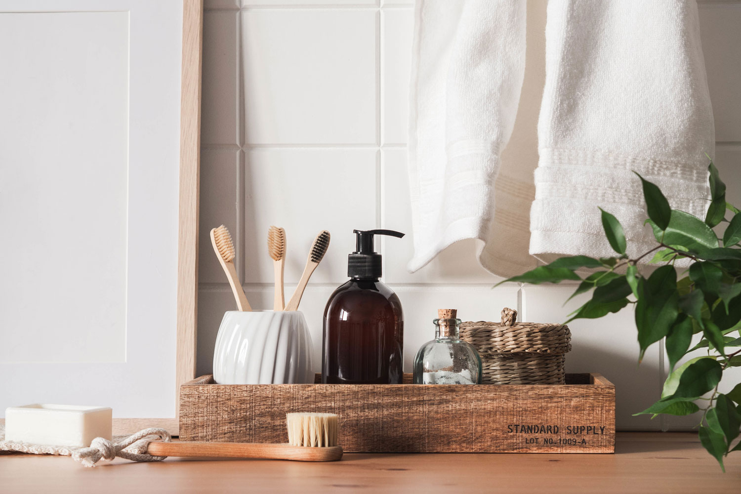 A wooden container for bathroom and grooming essentials