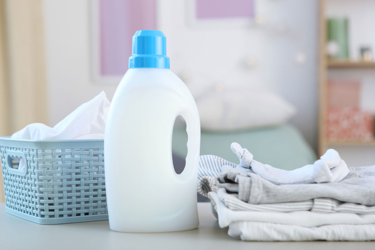 Baby clothes and detergents on the table
