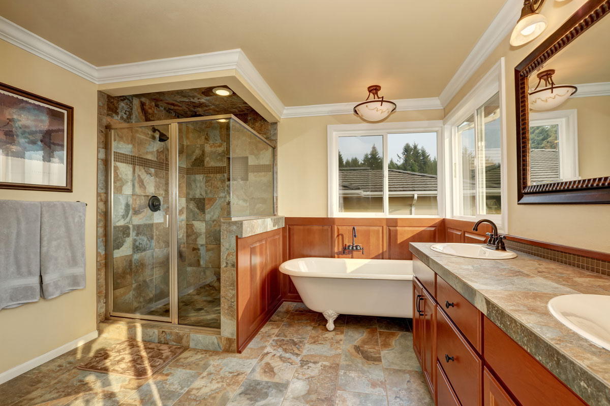 Bathroom with natural stone tile and beige walls