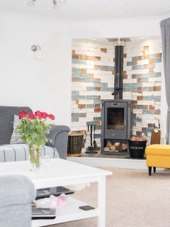 Bright Living room with stove, 13 Ideas For Decorating Around Wood Stove
