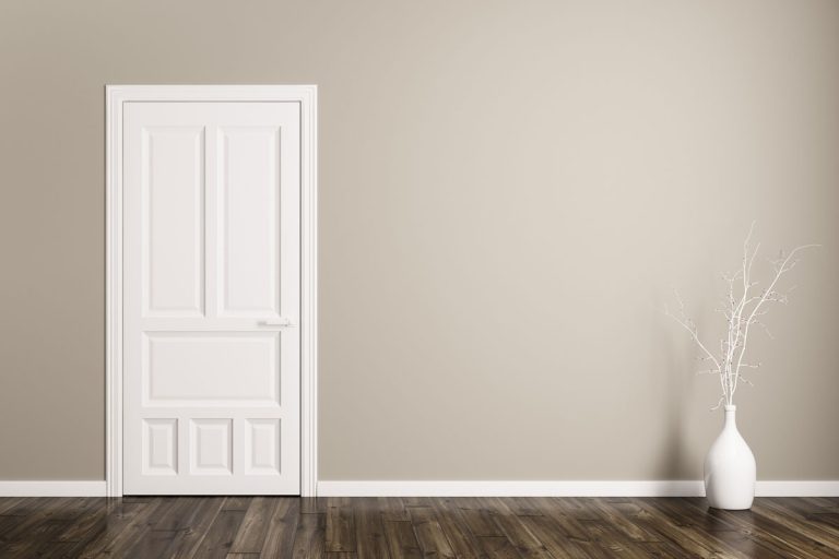 Interior wood white door in with white vase in ground, How To Paint A Wooden Door [Inc. In White]