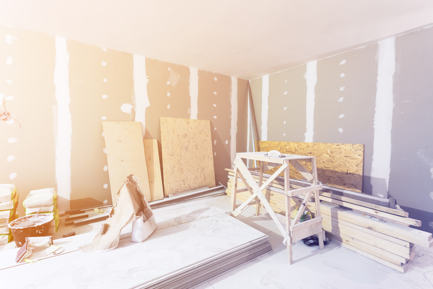 Materials for construction - putty packs, sheets of plasterboard or drywall- in apartment is under construction, remodeling, renovation, extension, restoration and reconstruction.