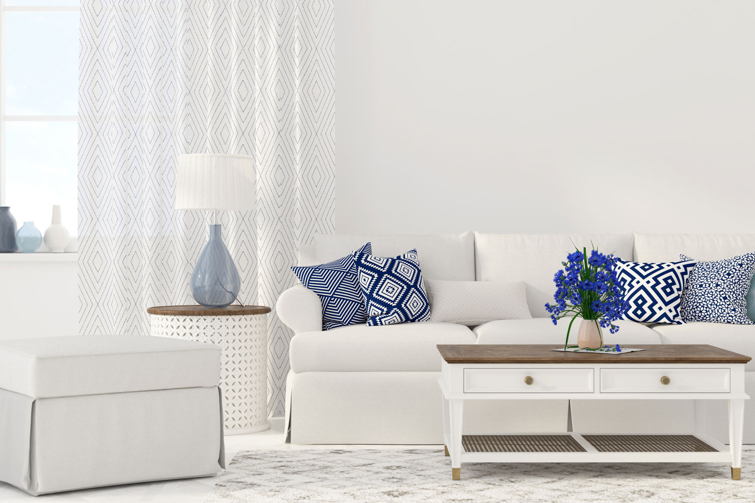 Modern contemporary living room with white sofas, blue patterned throw pillows and curtains