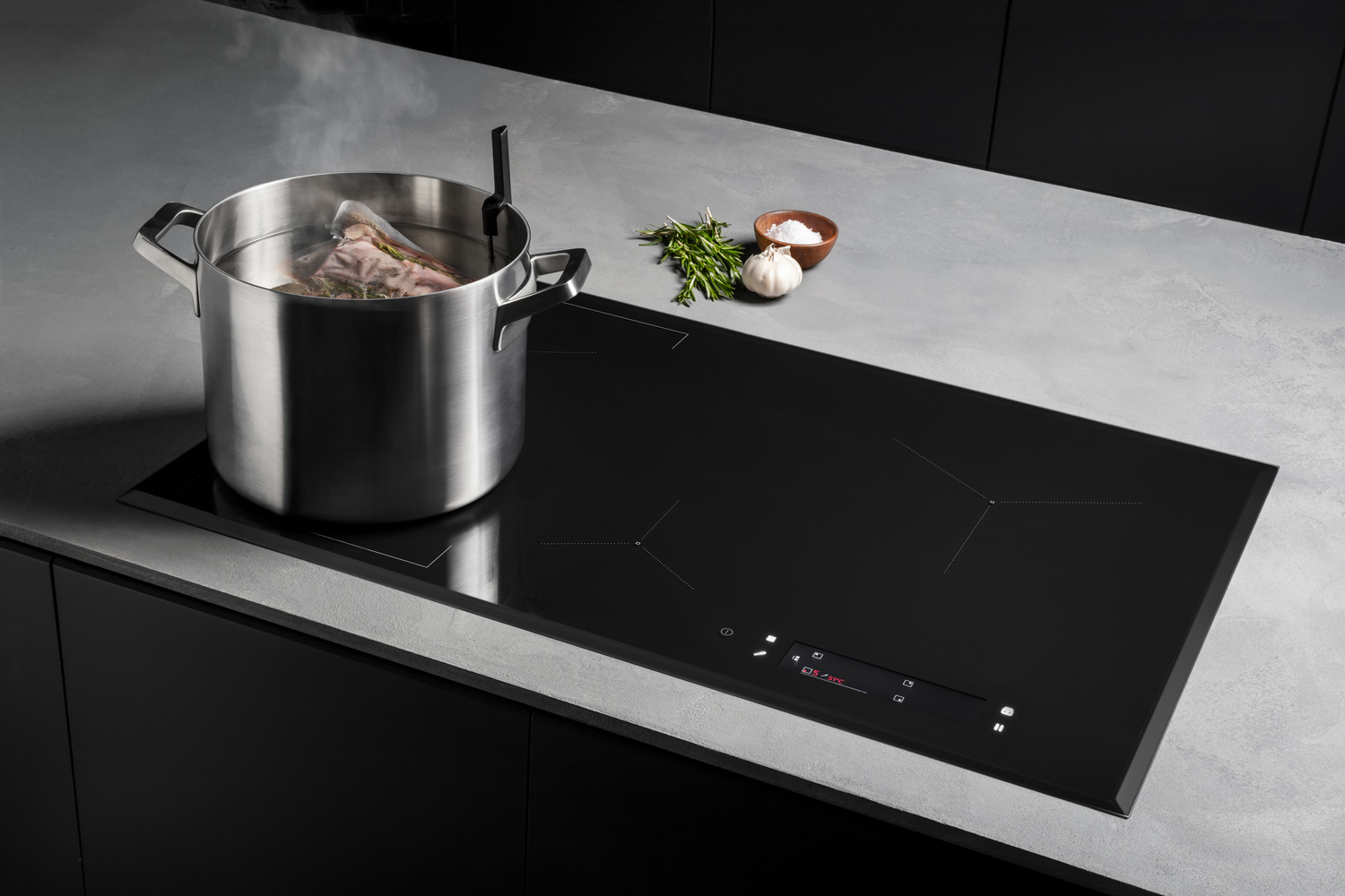 Modern induction cooker with saucepan in gray kitchen
