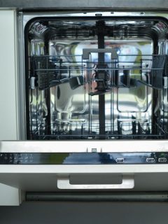 A modern white dishwasher with an open door on the kitchen, How To Find The Model Number On A Maytag Dishwasher
