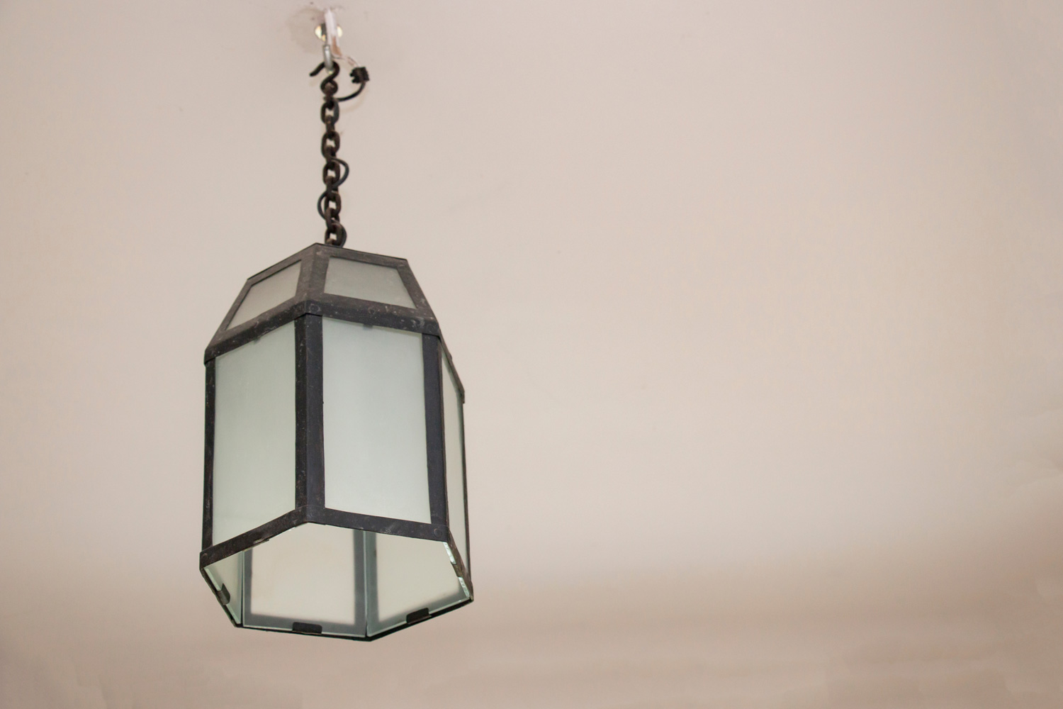 Pendant lamp in a black metal frame retro in a gray background