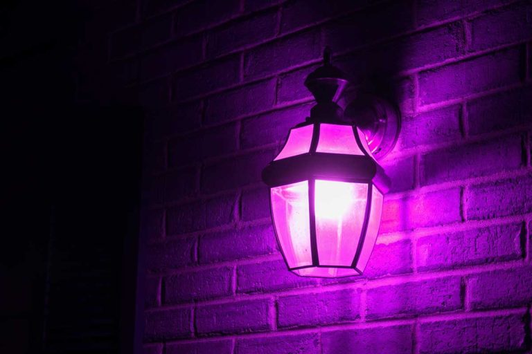 Purple light lantern illuminating the front porch at night, What Does a Purple Porch Light Mean?