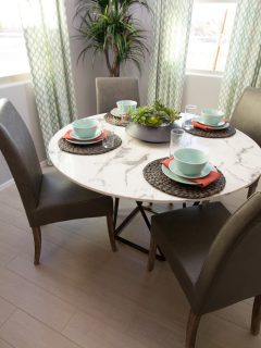Round Marble Table With High Back Chairs And Place Settings - What Size Dining Table For A 10X10 Room