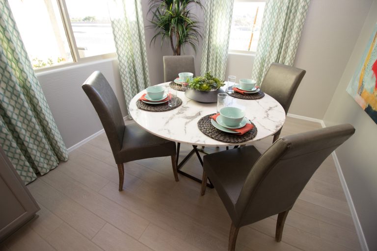 Round Marble Table With High Back Chairs And Place Settings - What Size Dining Table For A 10X10 Room
