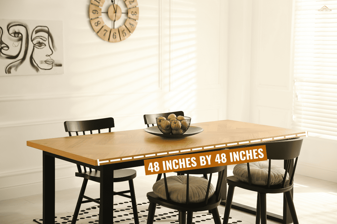Stylish wooden dining table and chairs in room. Interior design. - What Size Dining Table For A 10X10 Room?
