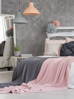Two small lampshades hanging in modern pastel girly bedroom - How To Place A Bed In The Bedroom