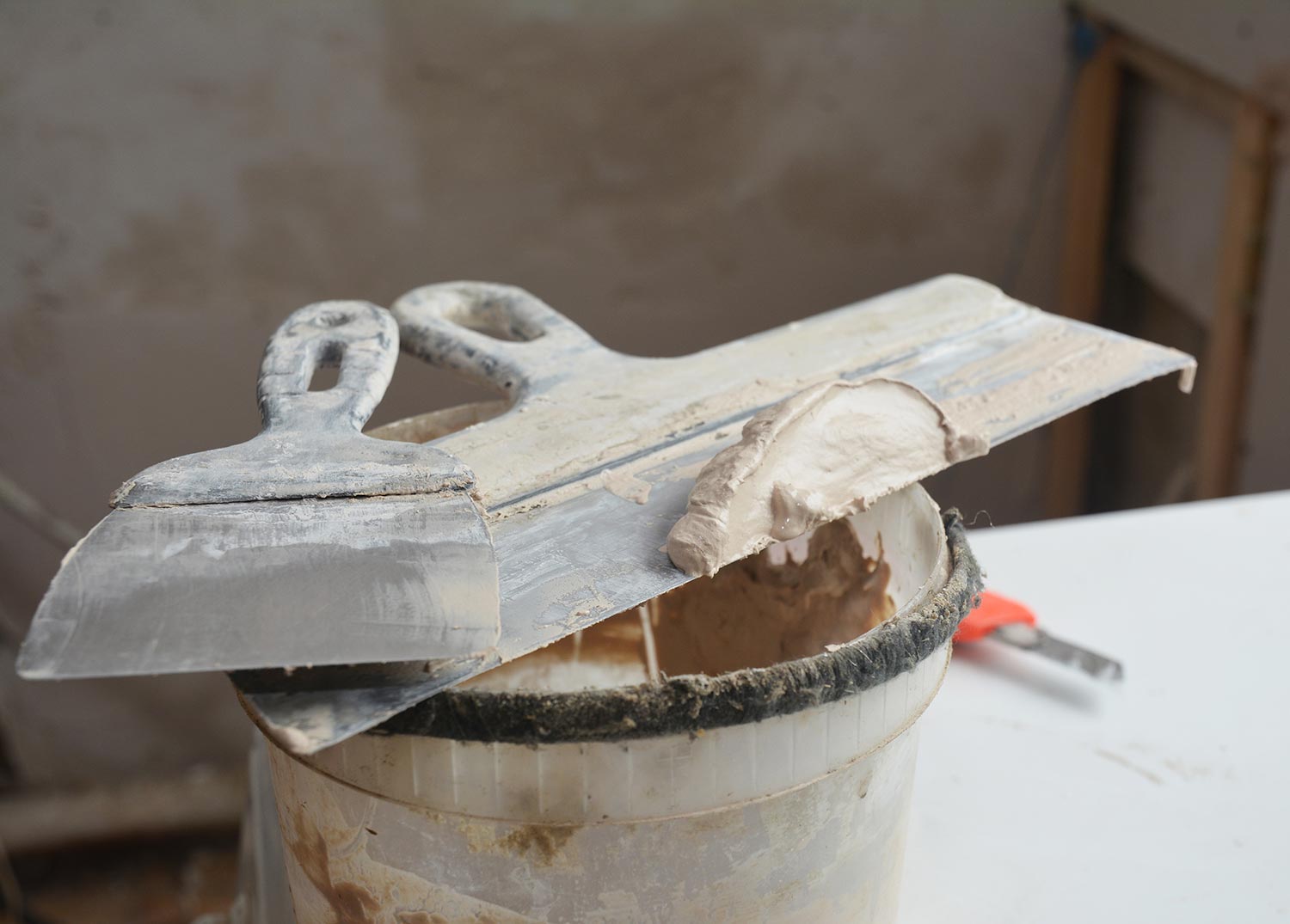 Two taping knives or joint knives, working tool of a builder used to spread joint compound