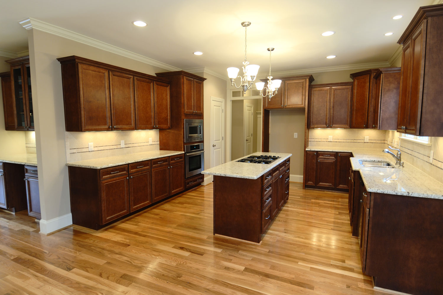 Ultra rustic classic kitchen with dark oak cabinets and cupboards matched with white marble countertop