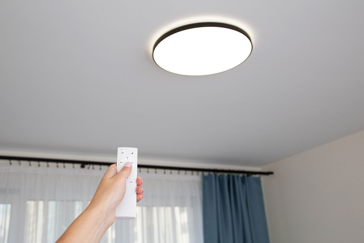 Woman turning the light on inside the room