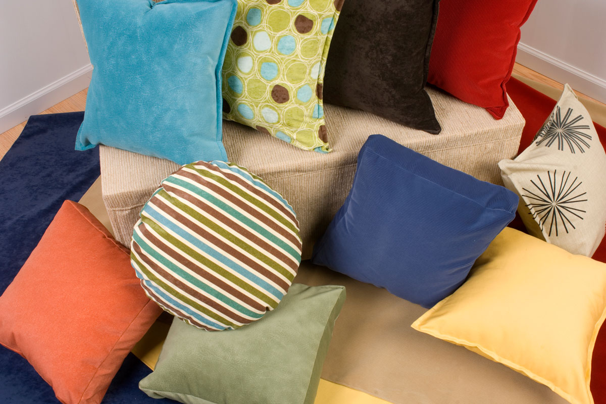 collection of colorful throw pillows in a variety of colors