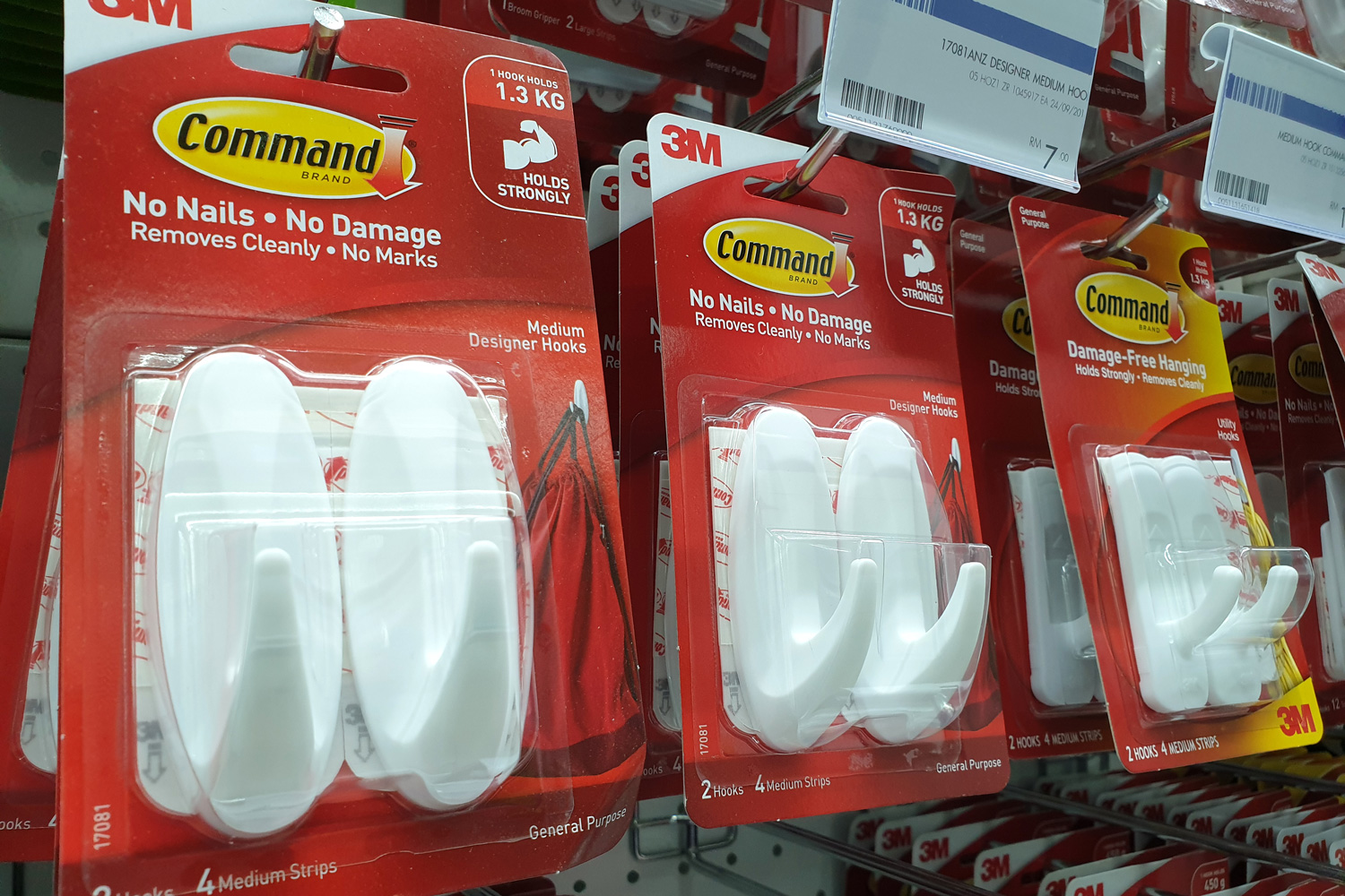 ommand brand Picture Hanging Strips and Hooks by 3M company on store shelf. 