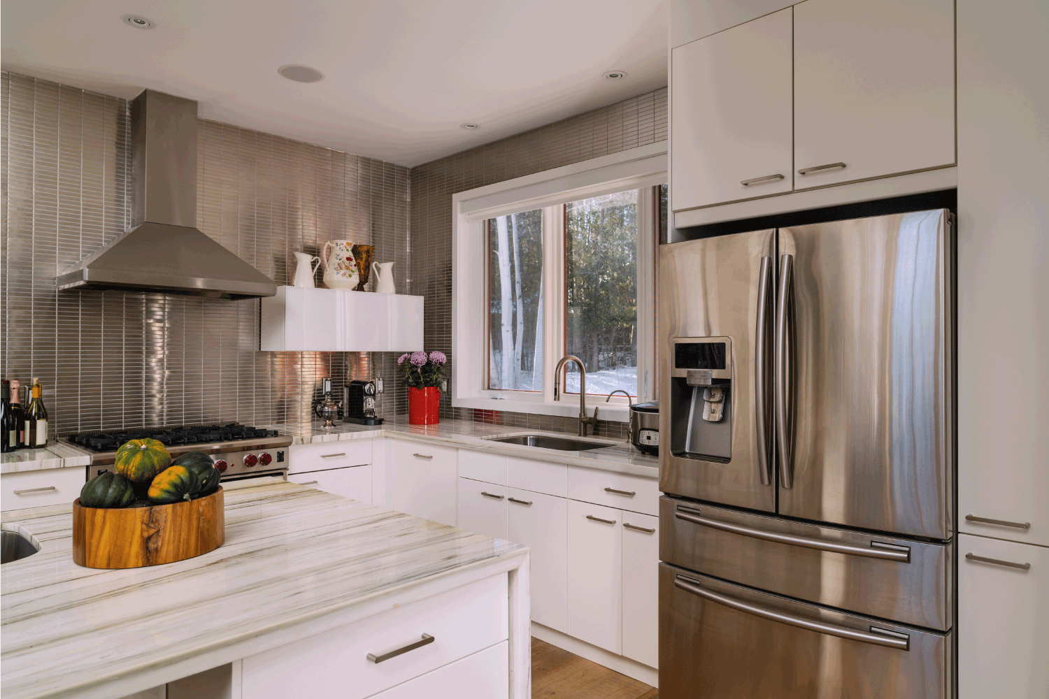 stainless steel refrigerator on a kitchen cabinet in plain white, granite countertops. How To Fill The Gap Between Fridge And Cabinet