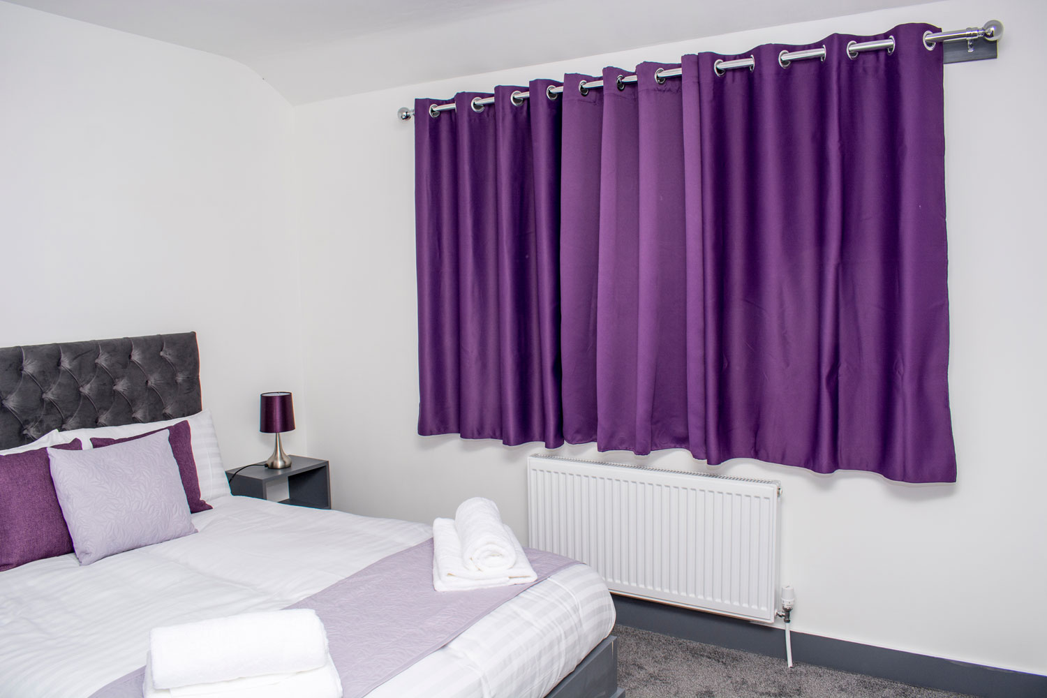 A thick violet colored curtain