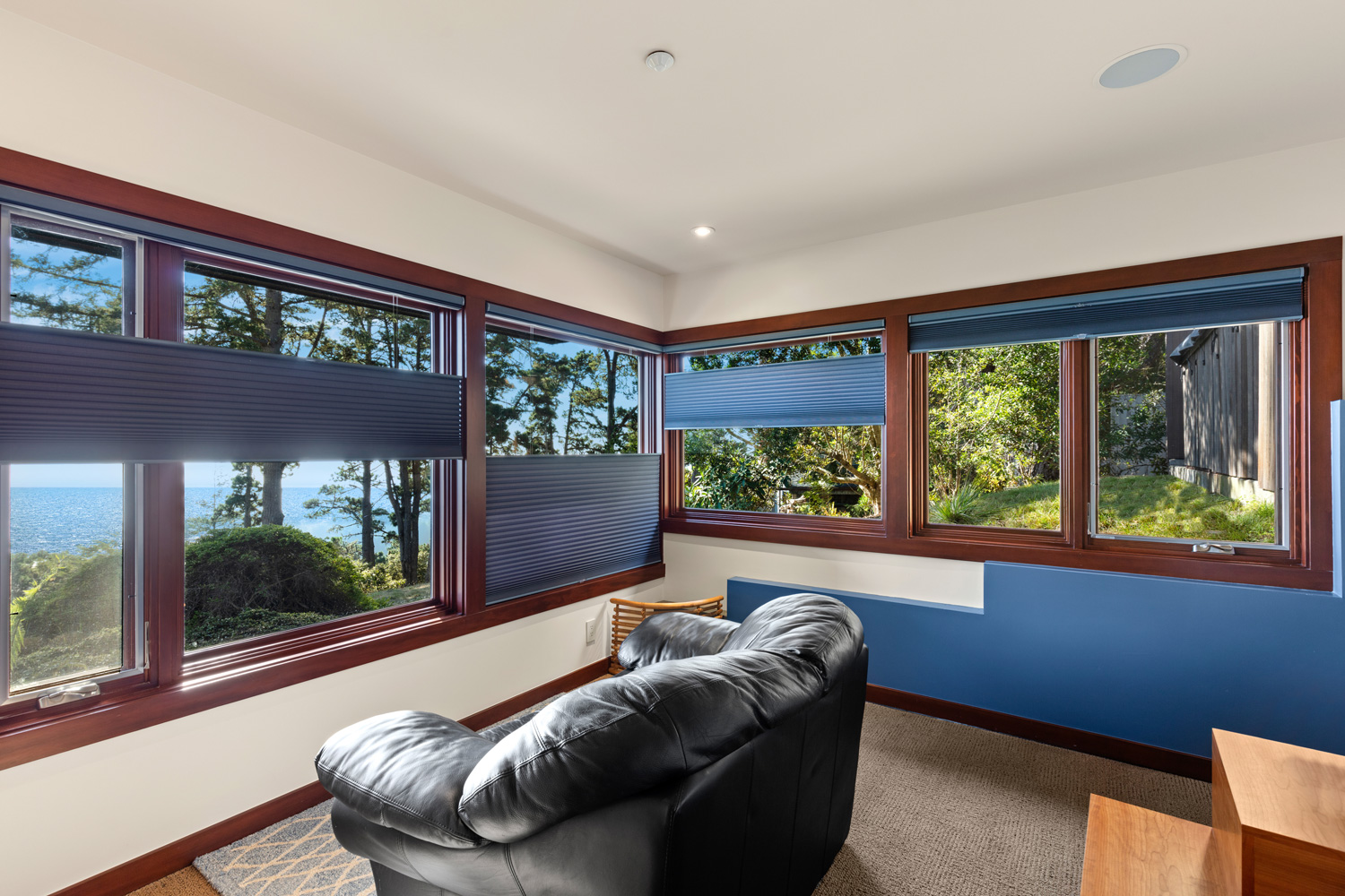 Blinds and Window treatments - Window coverings in home with view of the ocean