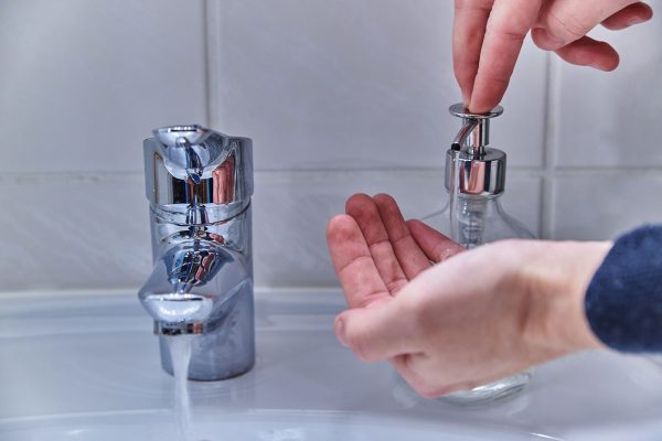 Close up of a person washing hands. Person washing their hands with soap, How To Find The Model Number On A Delta Faucet