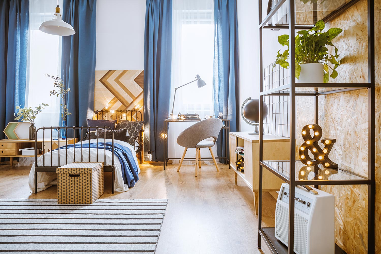 Interior bedroom for teenager with modern designed chair,blue elements and plants