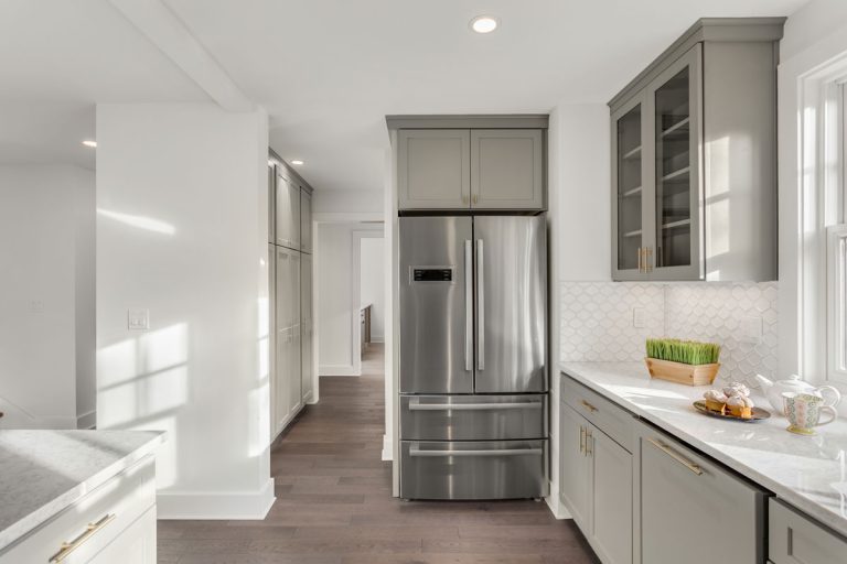 Kitchen Detail in Newly Remodeled Home: Hardwood Floors, Stainless Steel Refrigerator, Can You Put A Fridge On Carpet?