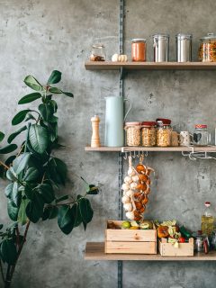 Kitchen and cooking essentials stacked on floating shelves, How High To Hang Floating Shelves?