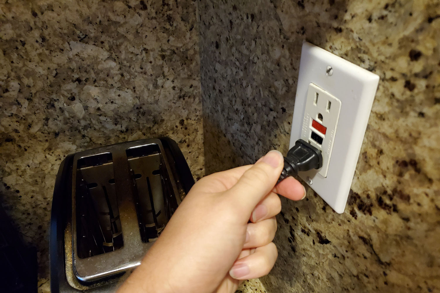 Man plugging in to a socket
