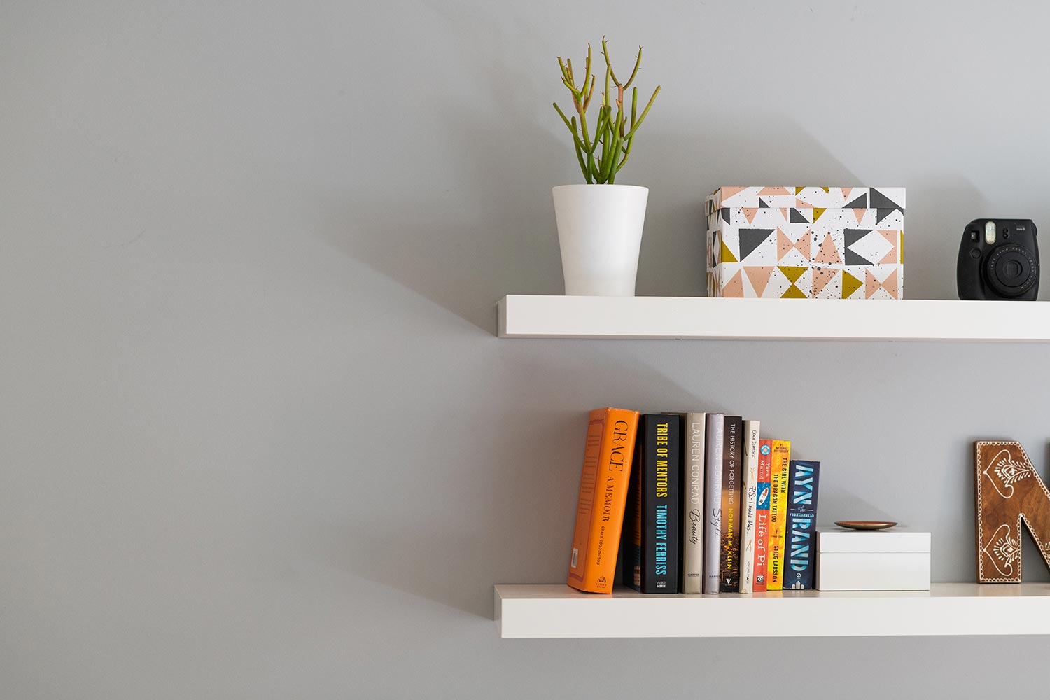 Modern floating bookshelves with books