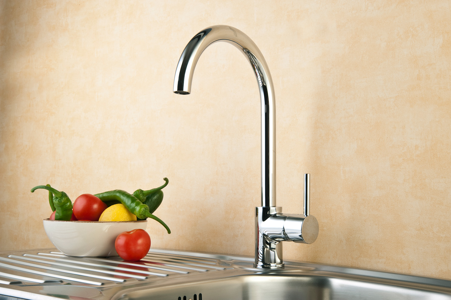 Modern stainles steel kitchen sink and chrome faucet.
