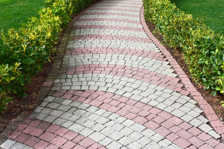 Patterned walkway pavers with flowers decorated on the sides, How Wide Should Walkways Be?