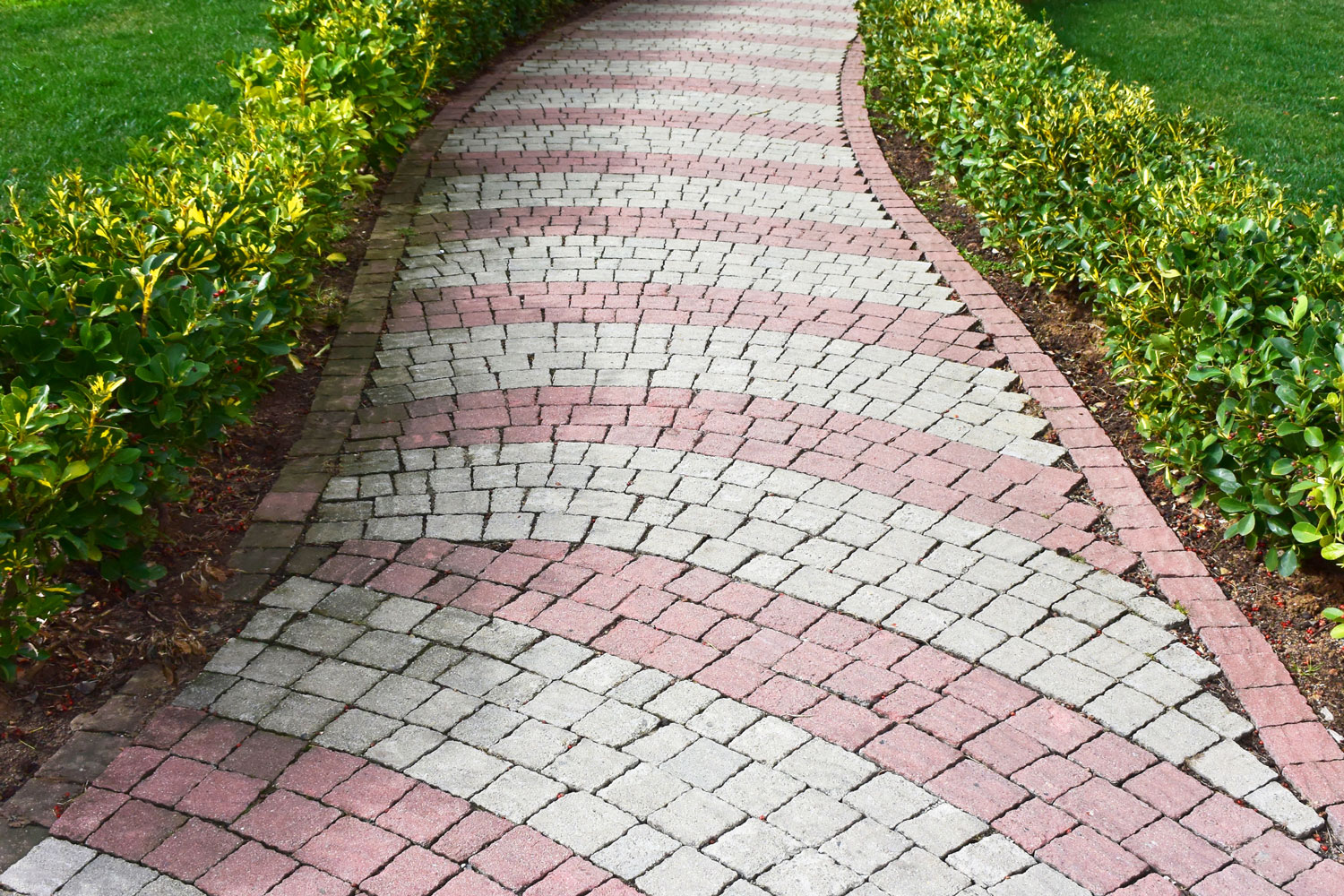 Patterned walkway pavers with flowers decorated on the sides