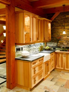 Rustic inspired basement with a marble kitchen countertop, 10 Support Beam Decorating Ideas