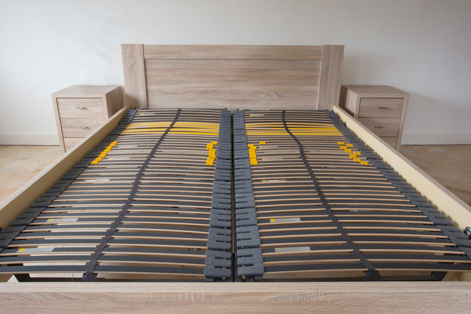 Slatted base, wooden element double bed frame close up in bedroom orthopedic interior
