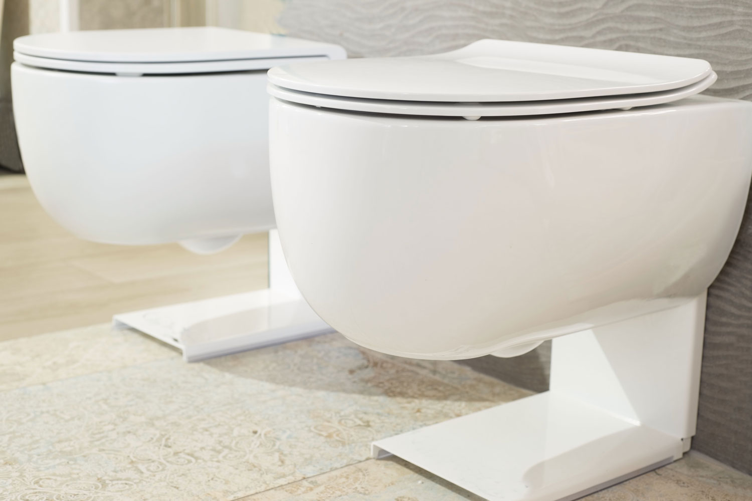 Two modern designed floating toilets