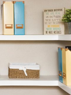 White floating shelves simply decorated with yellow and blue, How Deep Should Floating Shelves Be? What About Thickness?