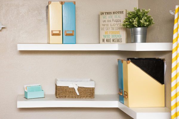 White floating shelves simply decorated with yellow and blue, How Deep Should Floating Shelves Be? What About Thickness?