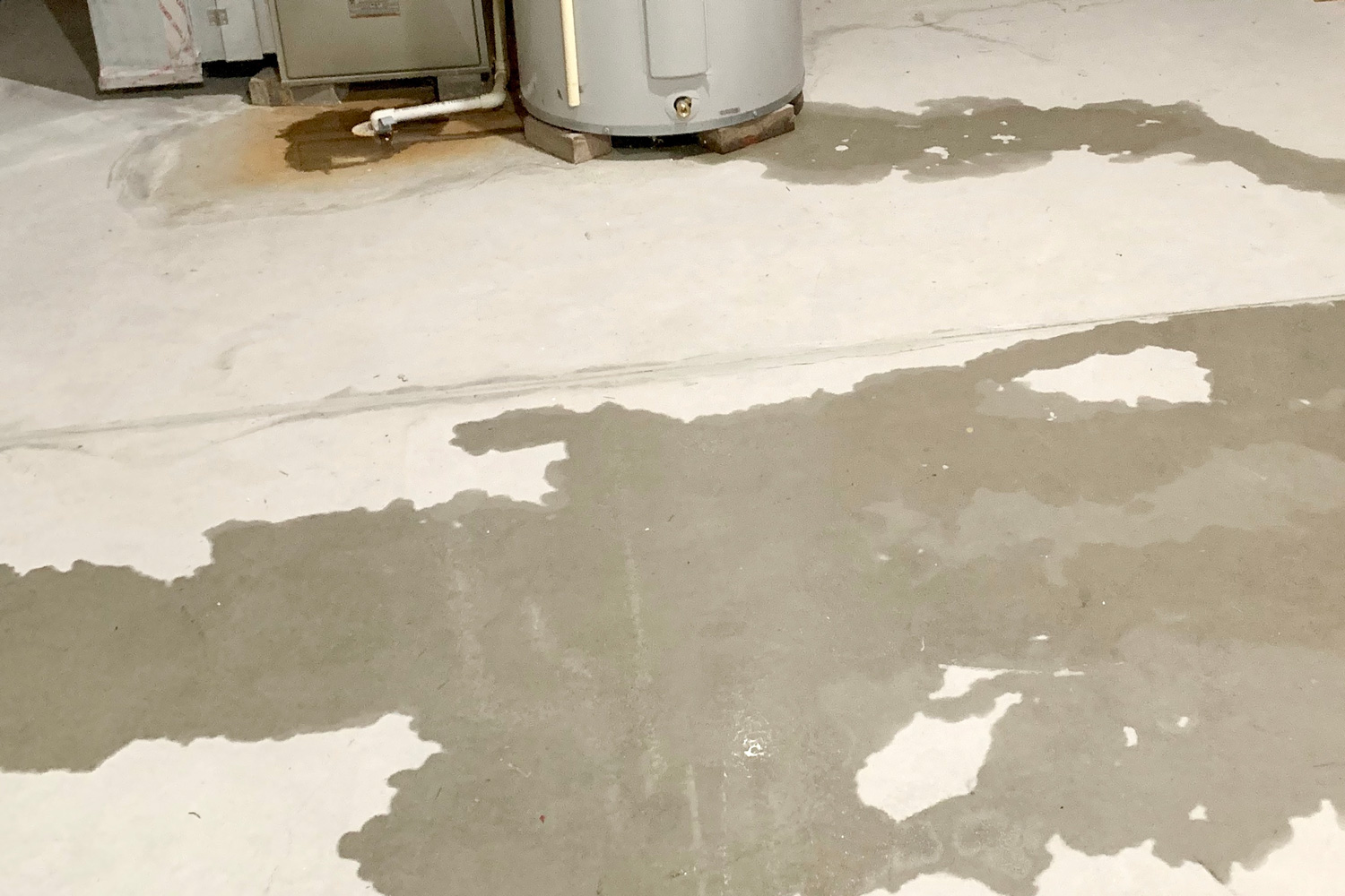 Water intrusion in basement with visible water on basement cement floor