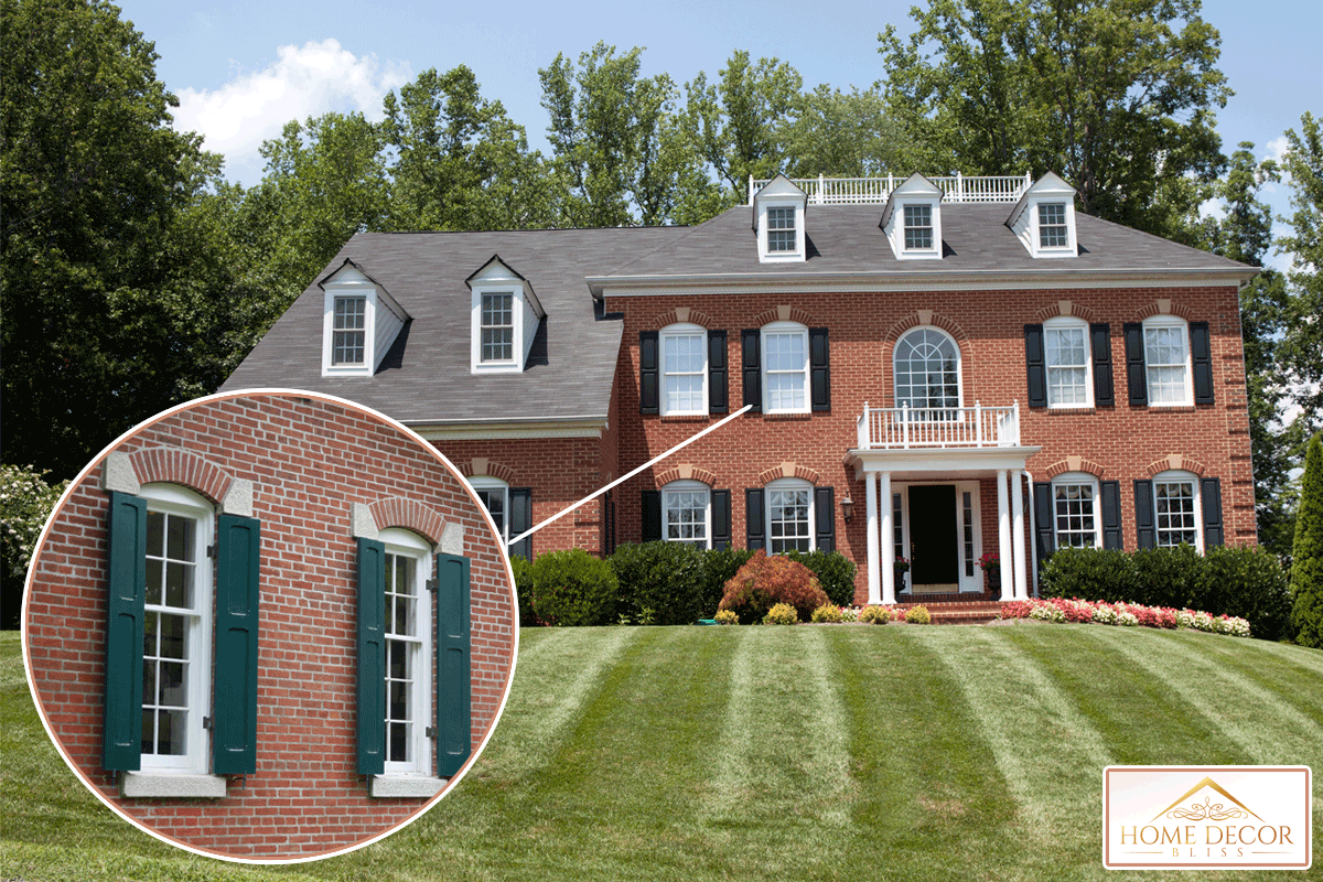 Large new American House in red brick with lovely green lawn in summer, What Color Shutters For A Red Brick House?