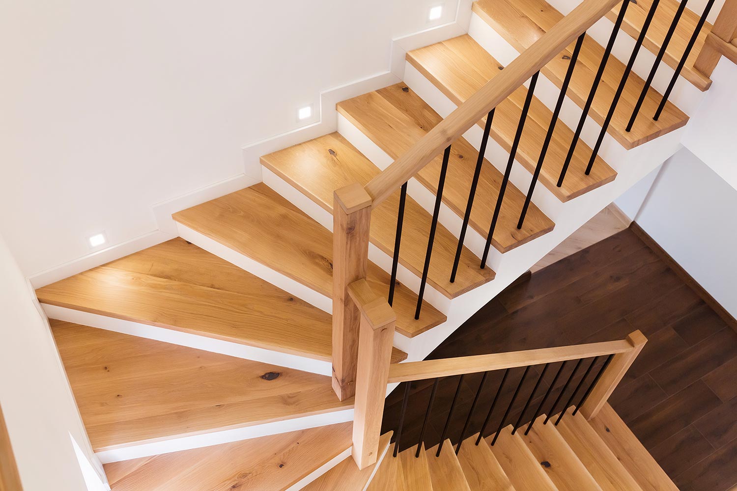 Wood staircase inside contemporary white modern house