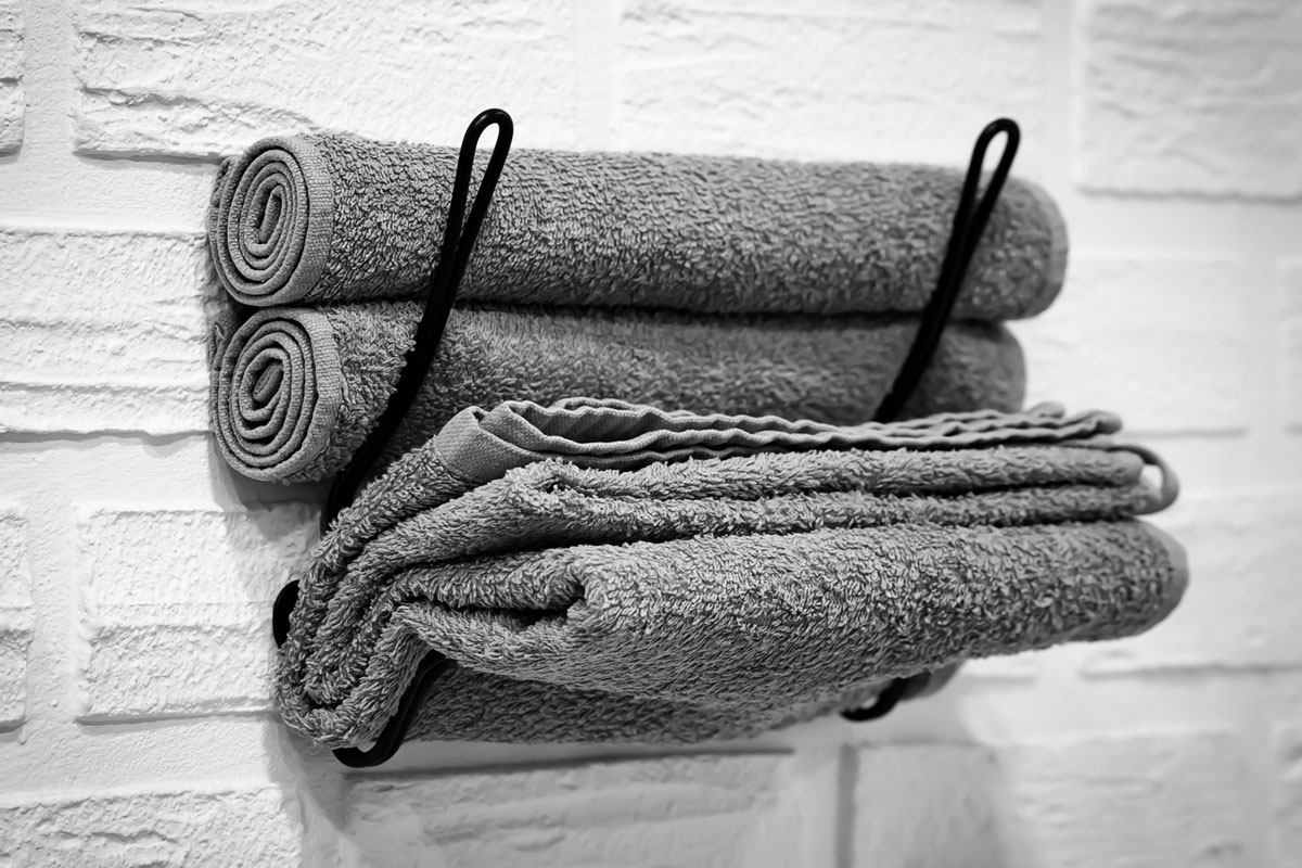 dark gray towel prepared on the bathroom