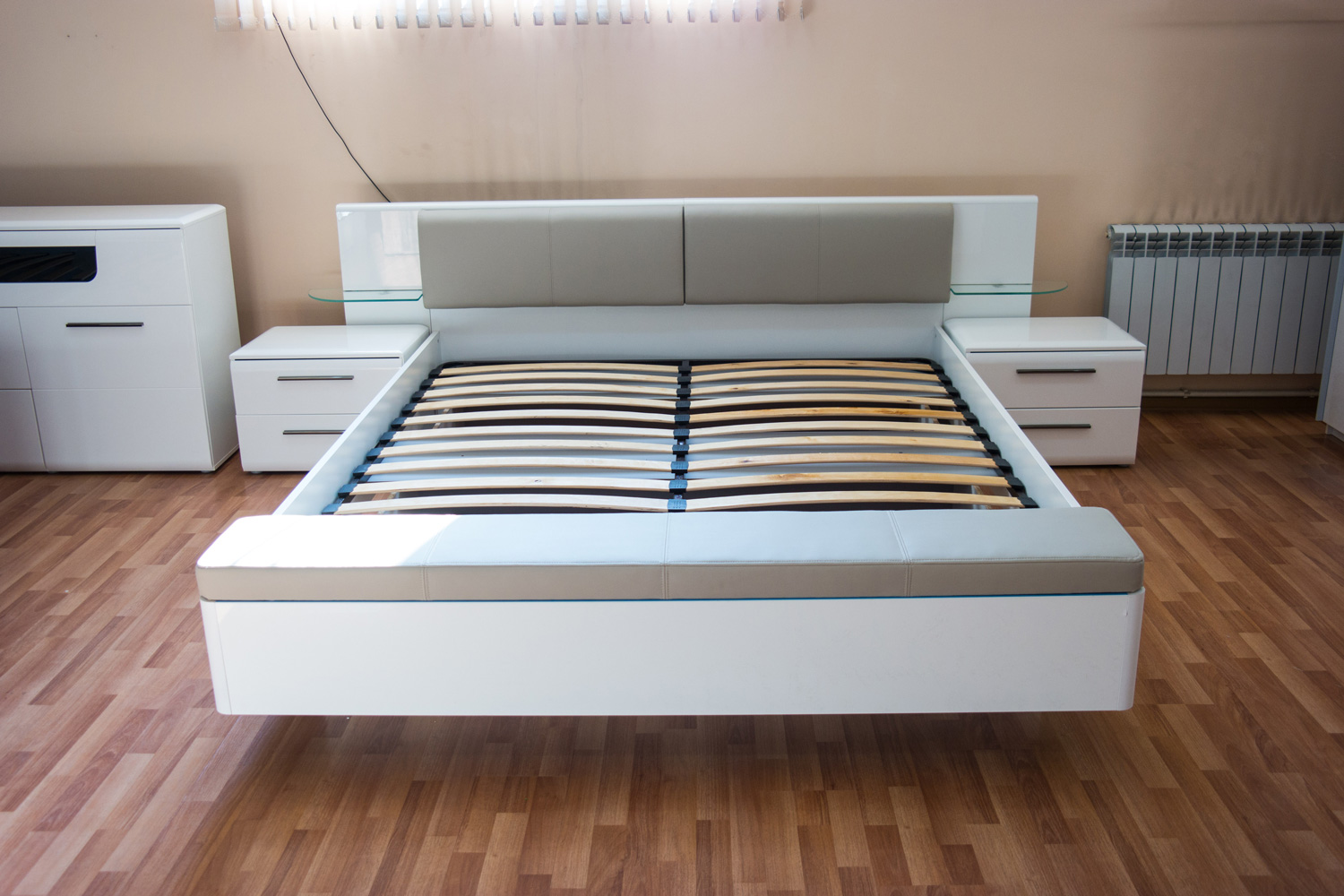 wooden bed without a mattress in the room