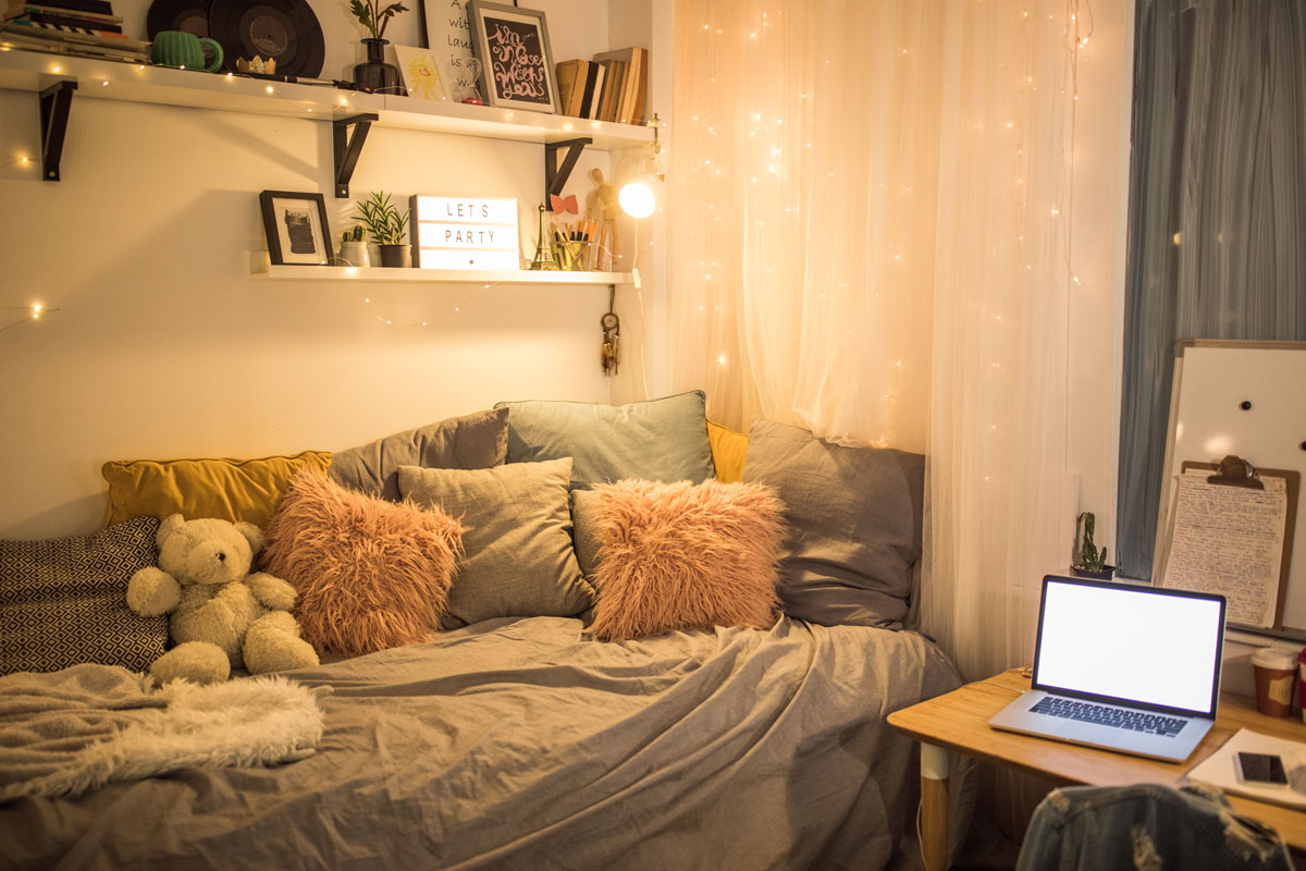 A gorgeous bohemian themed work area with a white divider and small night lights
